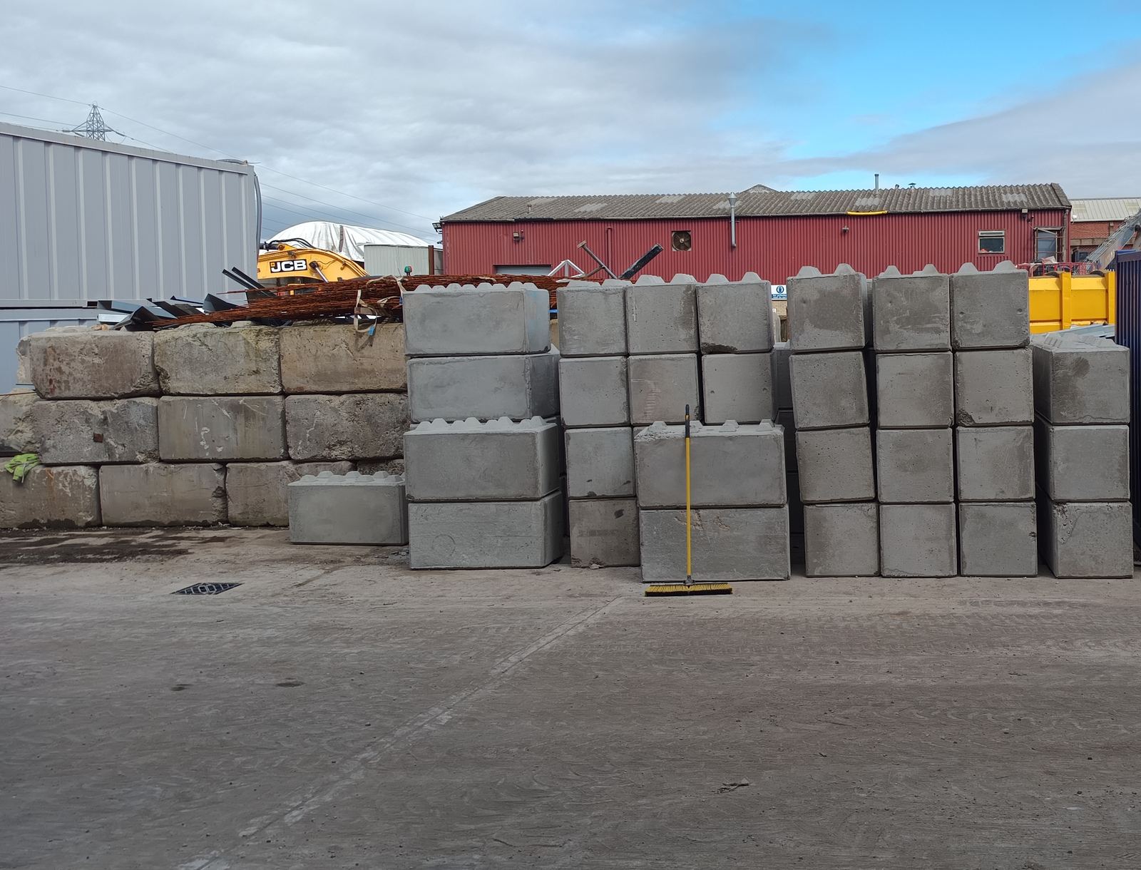 Interlocking concrete blocks stacked on site after delivery